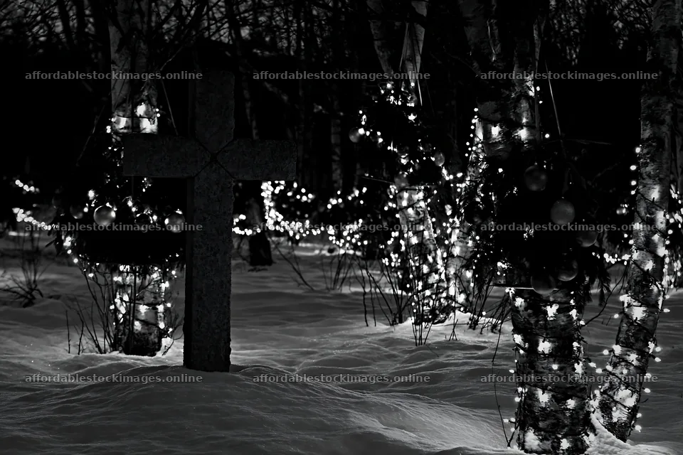 Stone Christian cross in snowy meadow with lights – stock images 9722x6480