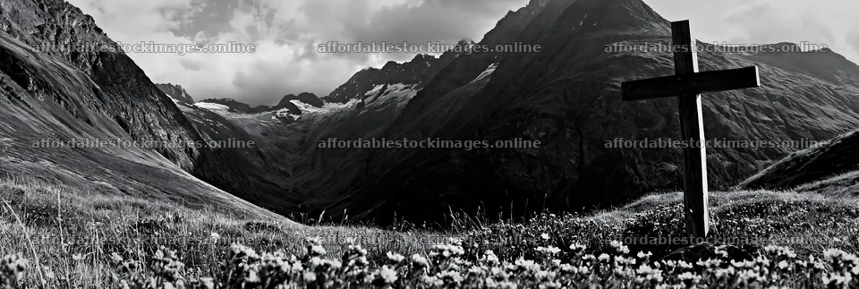 Wooden cross in a mountain meadow surrounded by flowers – stock images 13690x4602