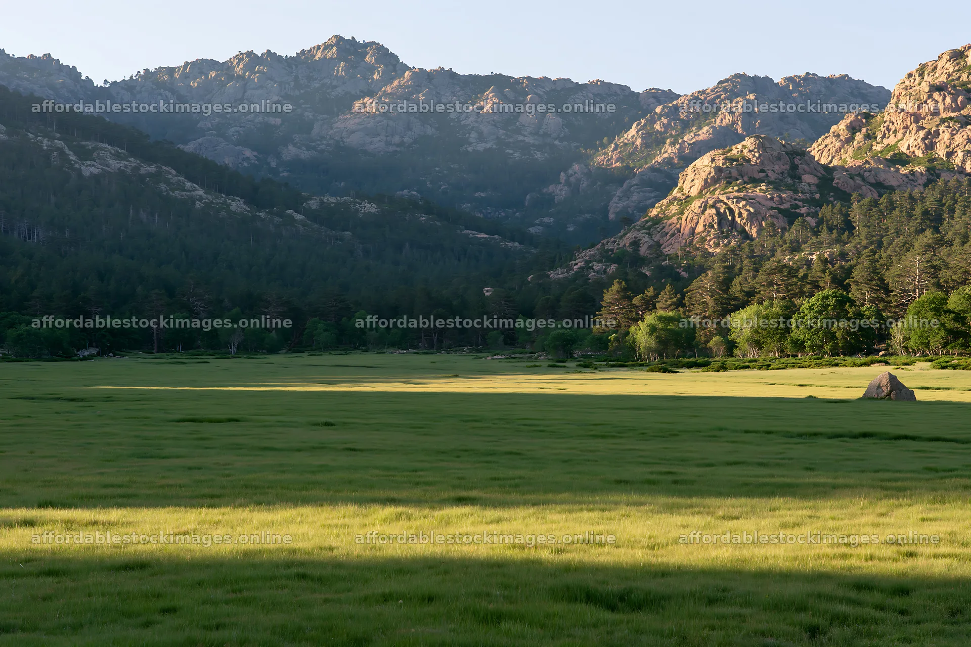 Meadow under mountain sunrays at dawn – stock images 9722x6480