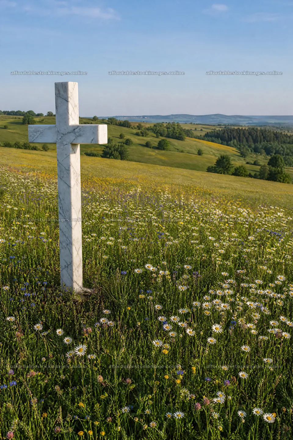 Marble Christian cross in meadow with flowers and hills – stock images 6480x9722