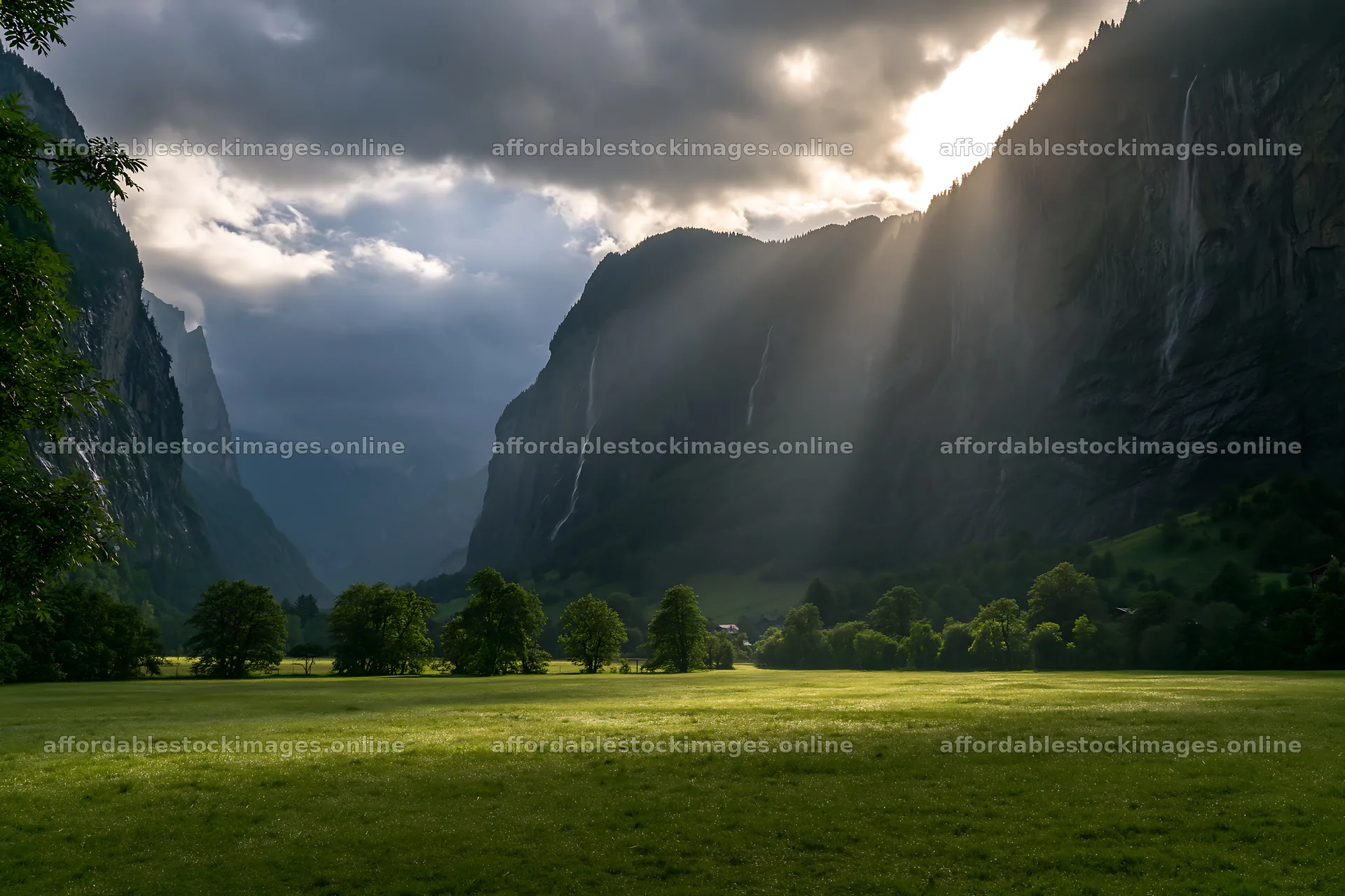 Lauterbrunnen Valley meadow light rays create dramatic scenery – stock images 9722x6480