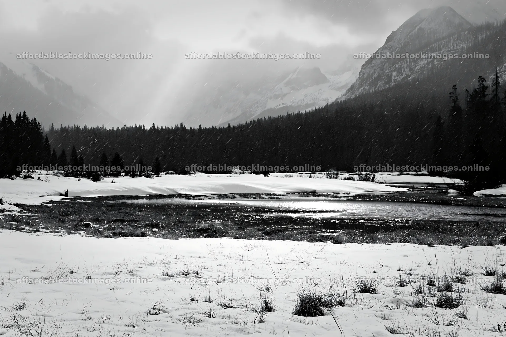 Snowbound meadow with mountains and overcast sky – stock images 9722x6480