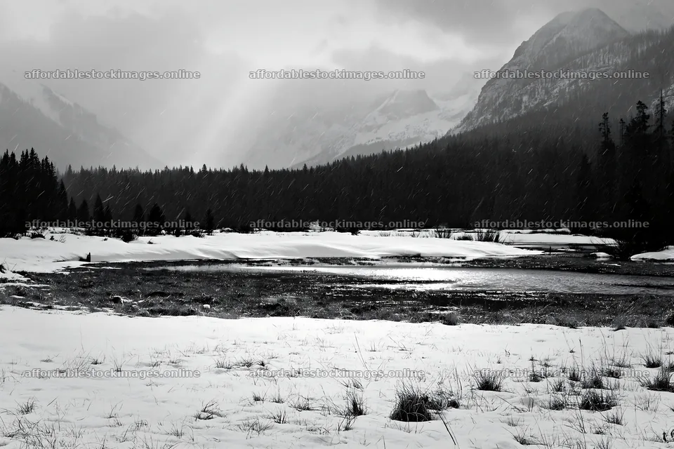 Snowbound meadow with mountains and overcast sky – stock images 9722x6480