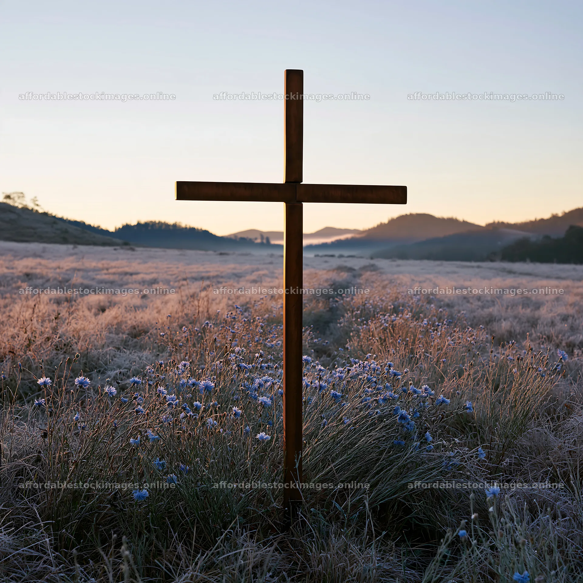 Bronze Christian cross in a meadow during Christmas – stock images 7938x7938