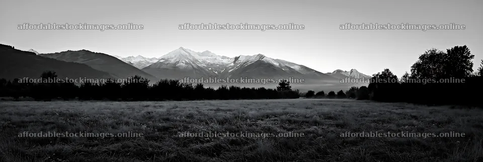 Highland apple meadow with mountains and early morning light – stock images 13690x4602