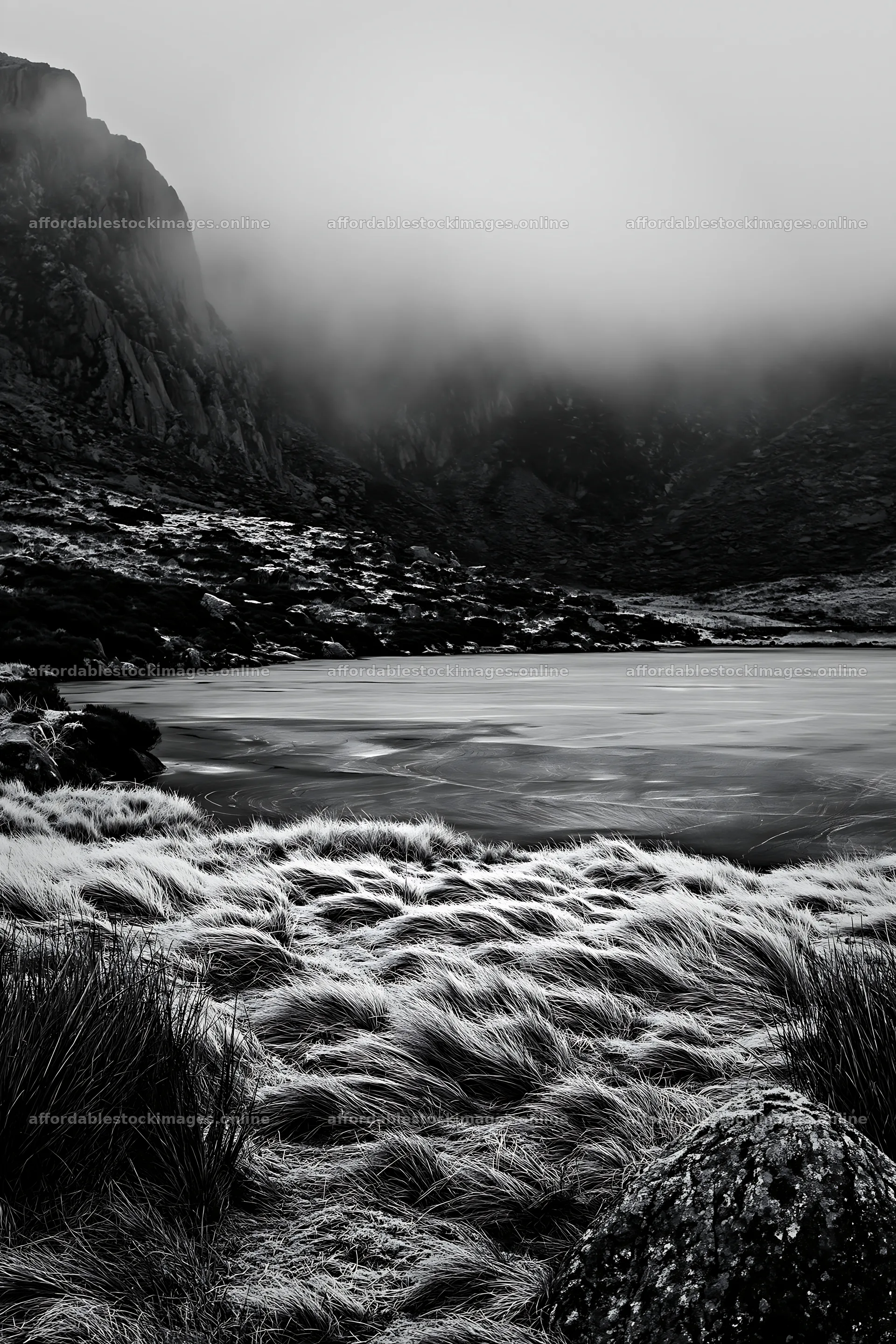 Frozen tarn meadow with fog over the water and rocky landscape – stock images 6480x9722