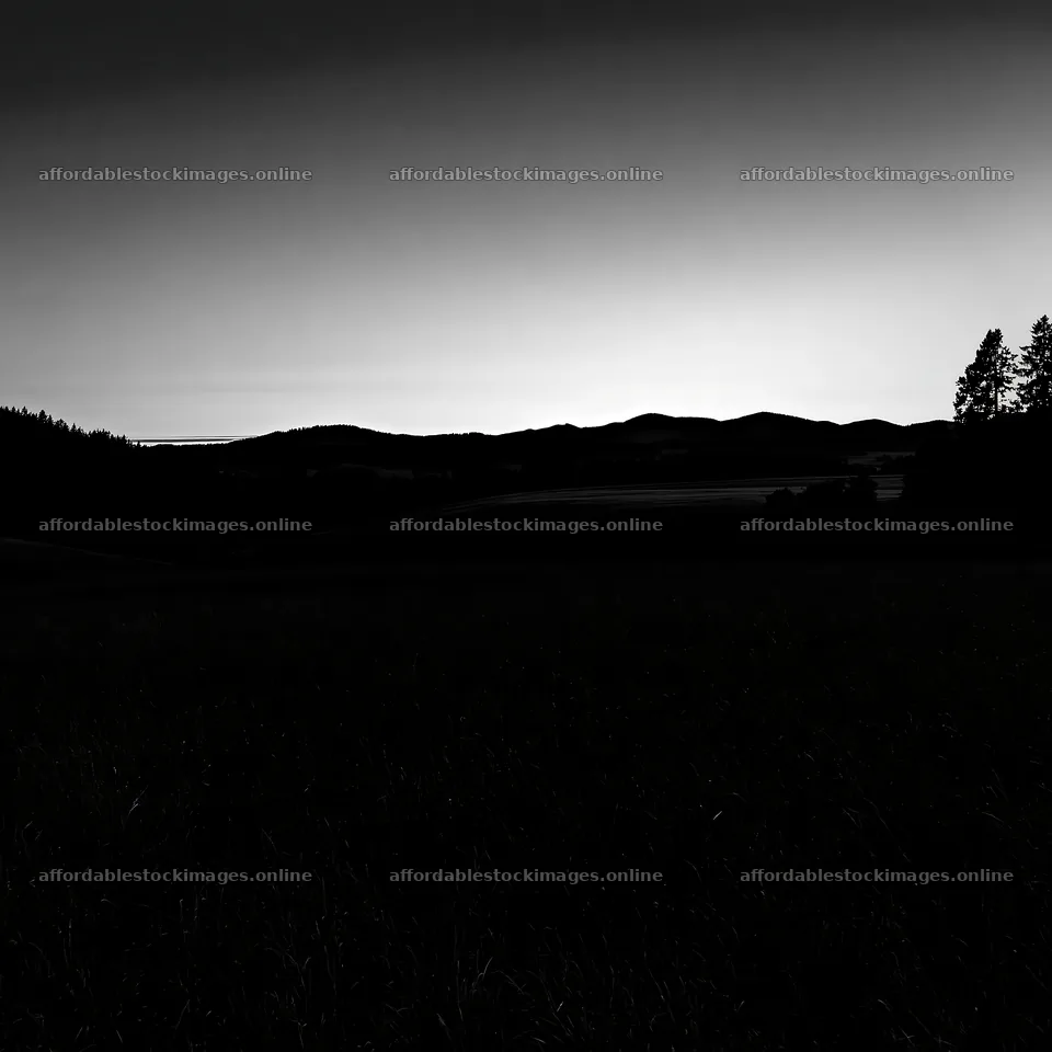 Rolling valley meadows at dusk with distant mountain silhouettes – stock images 7938x7938
