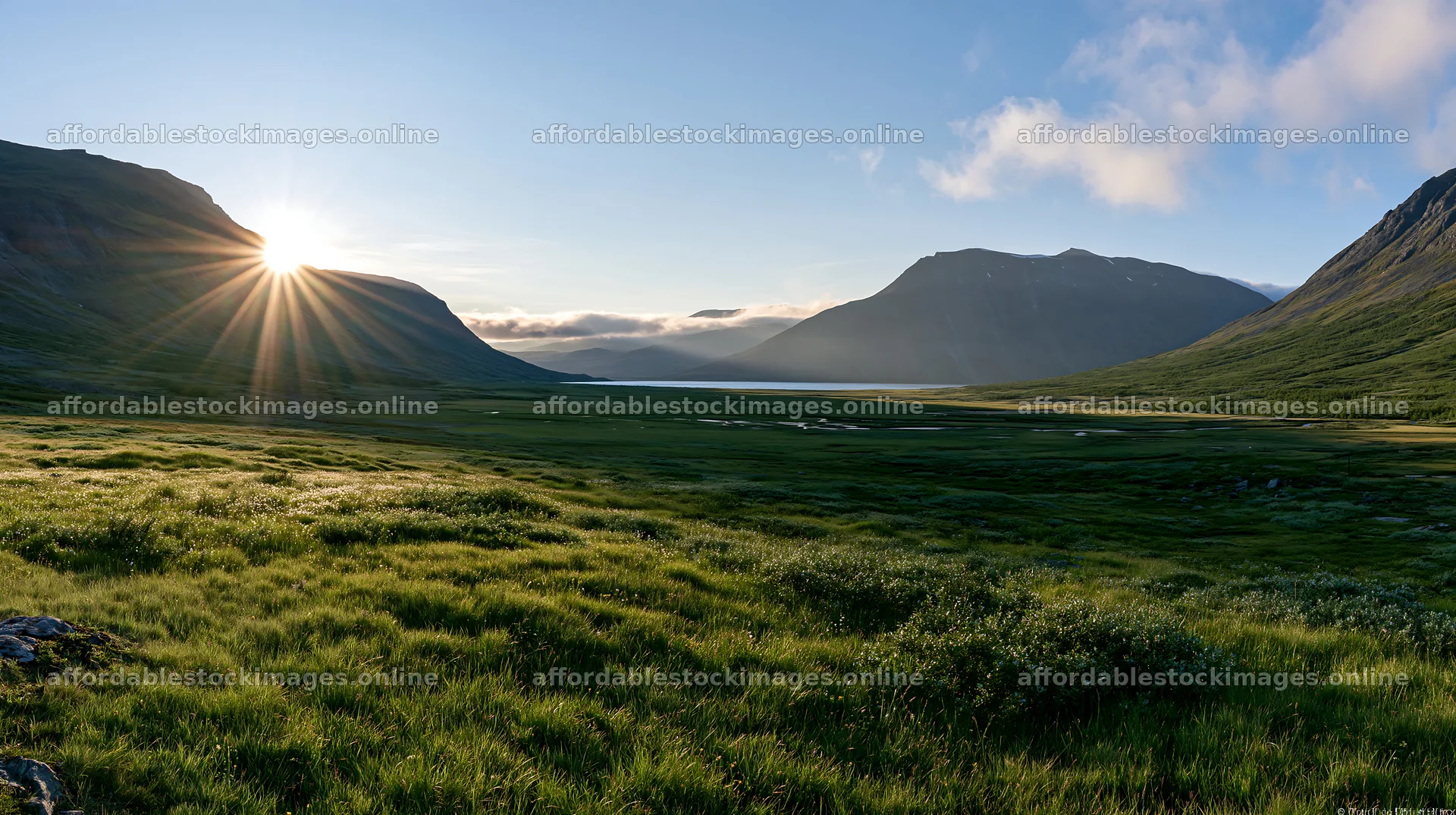 Sunbeams shine over Jotunheimen valley meadow in Norway – stock images 10608x5938