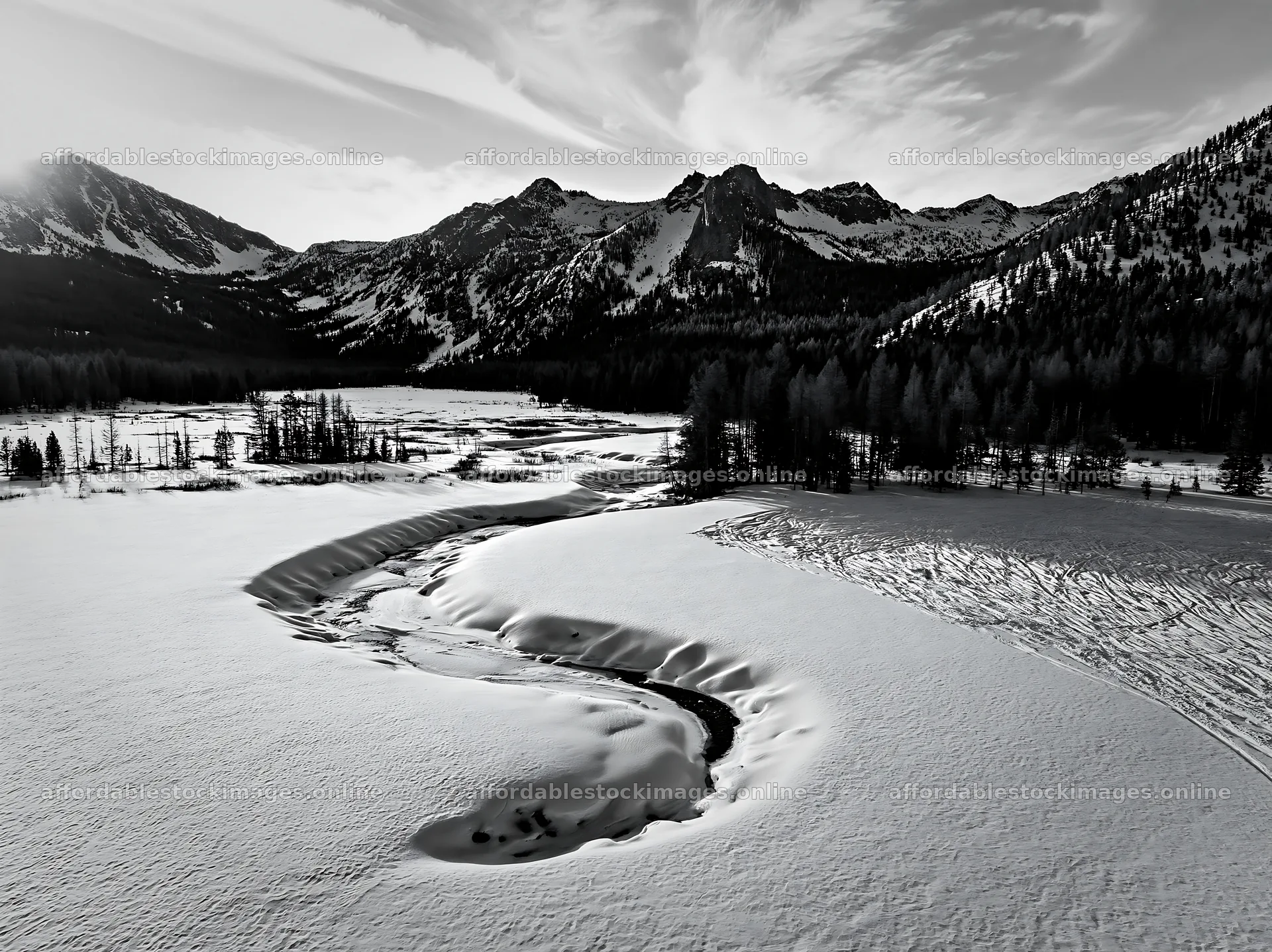Aerial view of snowy meadow valley surrounded by mountains – stock images 9174x6866
