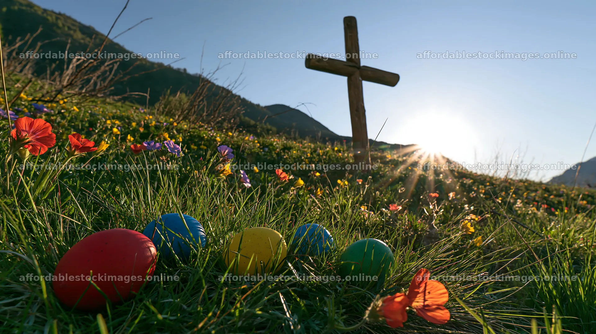 Christian cross in summer meadow with colored eggs – stock images 10608x5938
